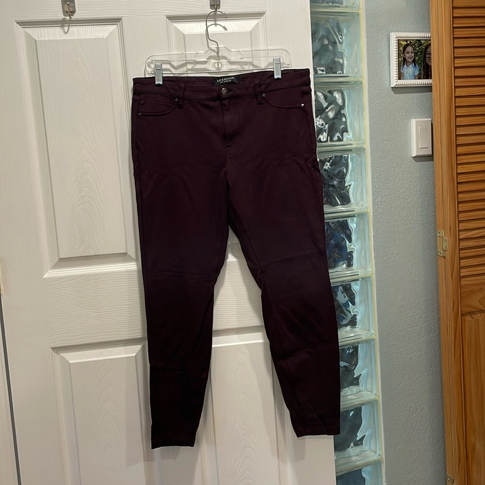 Purple/mulberry skinny jeans.